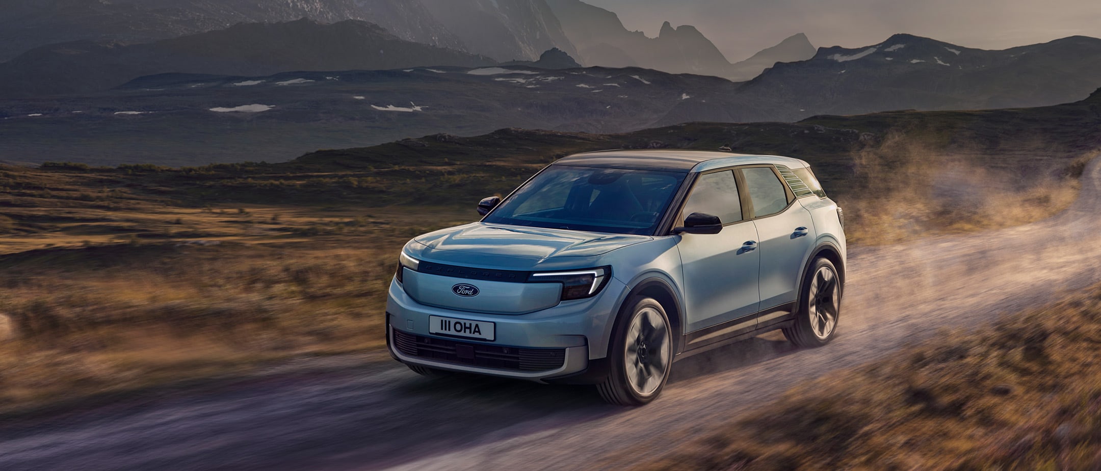 The New All-Electric Explorer being driven through wild landscape