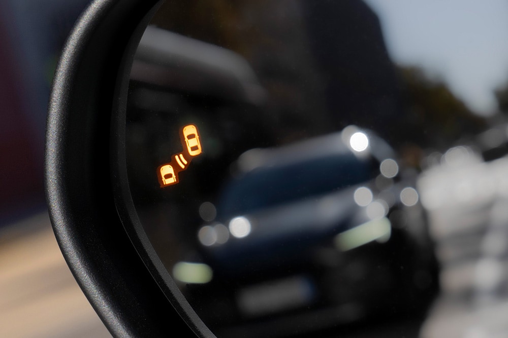 New Ford Puma using Blind Spot Information system to show cars in the blind spot.